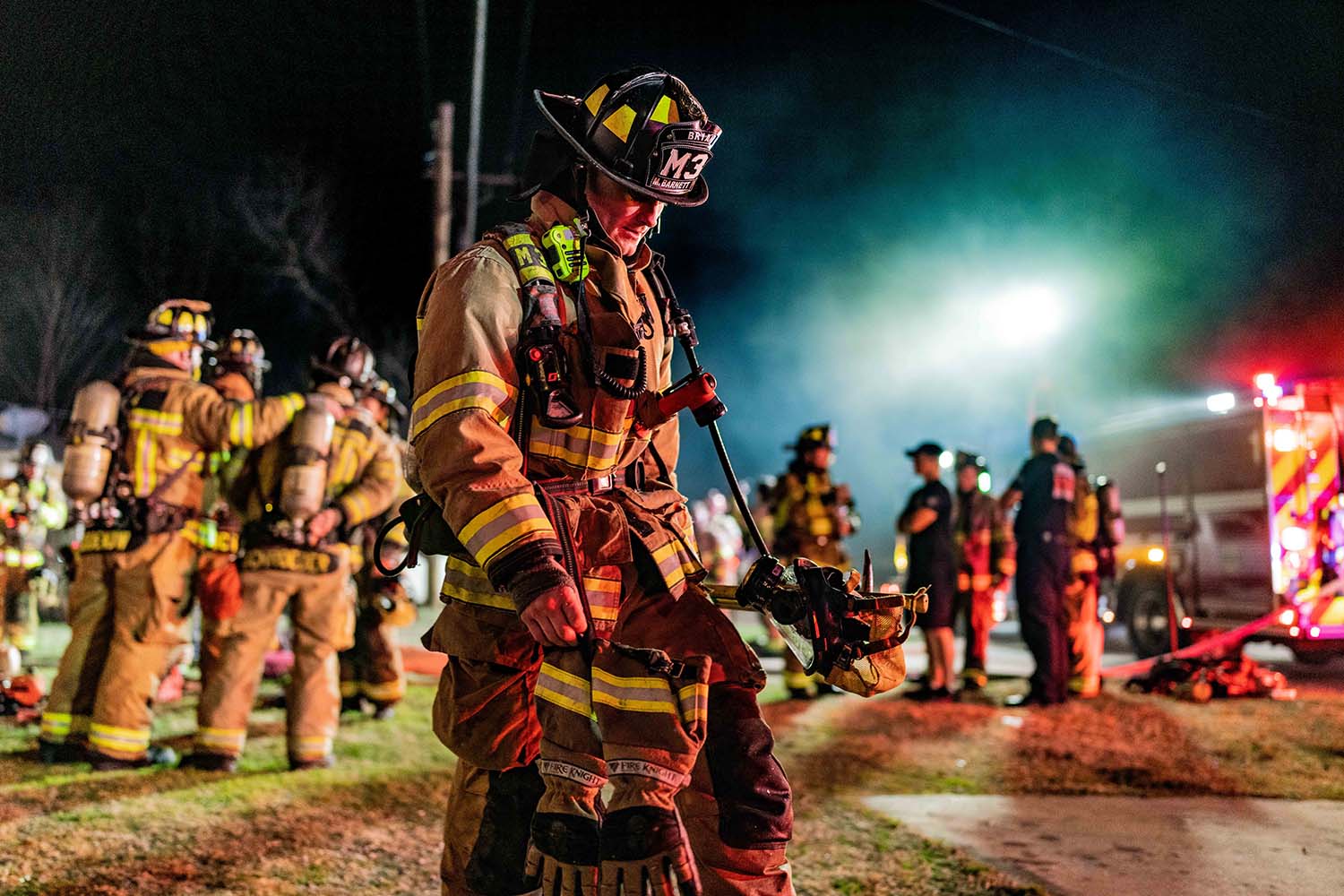 Bryan firefighter at the scene of a residential structure fire.