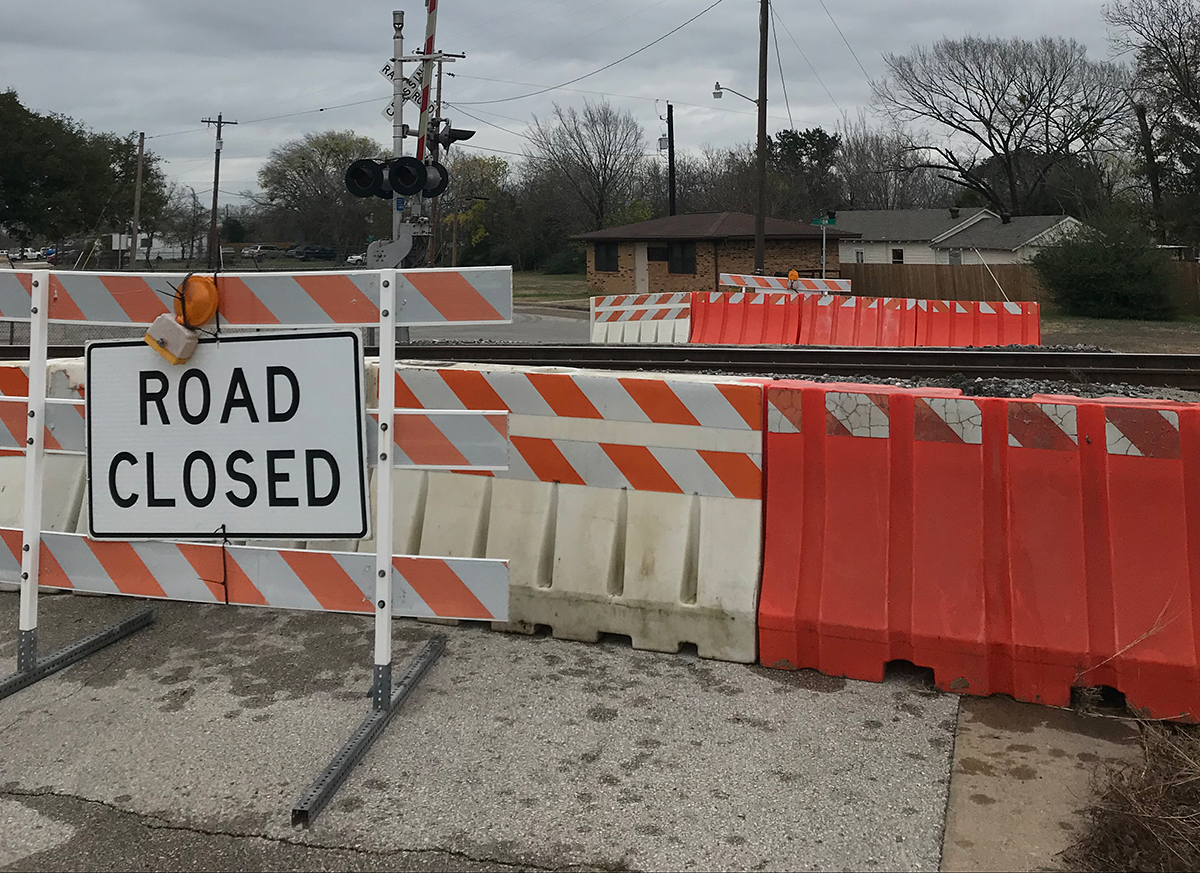 road closed signs at a railroad crossing in Bryan, Texas